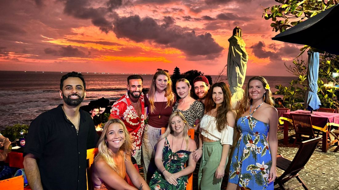 Work Wanderers group at sunset in Uluwatu, Bali